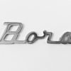 MA16 Scritta BORA cromata mm.90 con 2 perni filettati a tergo