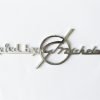 MI7 Scritta STYLED BY G. MICHELOTTI cromata, lunghezza mm.85, con 2 perni a tergo